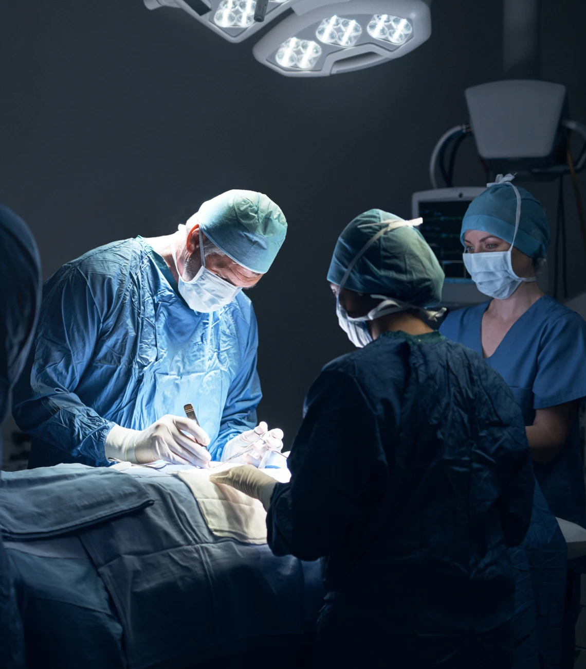 Doctors focused on patient surgery